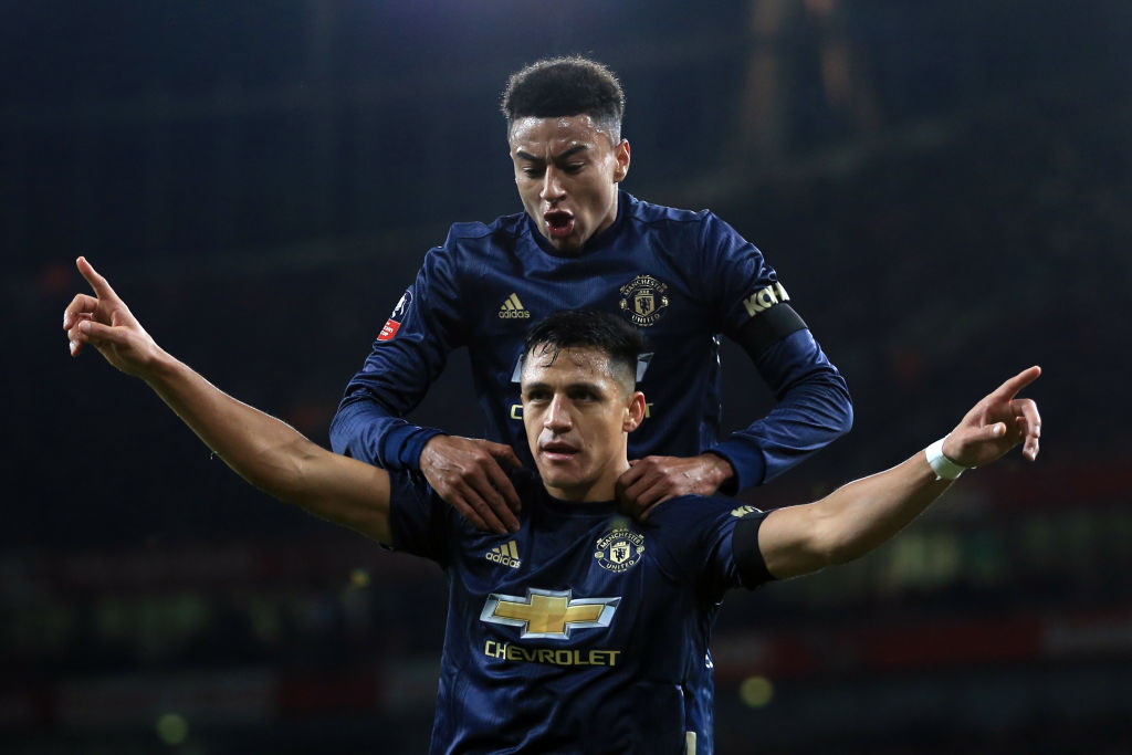 LONDON, ENGLAND - JANUARY 25: Alexis Sanchez of Manchester United celebrates scoring the opening goal with Jesse Lingard during the FA Cup Fourth Round match between Arsenal and Manchester United at Emirates Stadium on January 25, 2019 in London, United Kingdom.