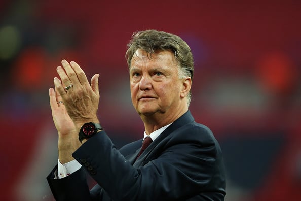 LONDON, ENGLAND - MAY 21: Louis van Gaal Manager / head coach of Manchester United watches his players celebrate victory after The Emirates FA Cup ...