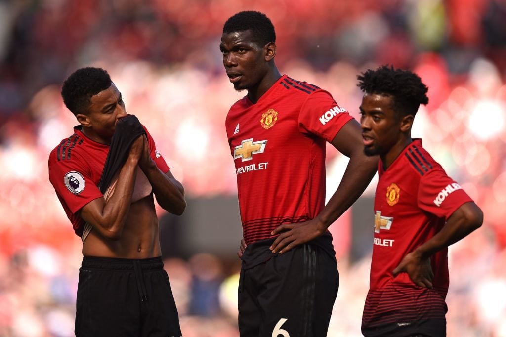 Manchester United's French midfielder Paul Pogba (C), Manchester United's English midfielder Jesse Lingard (L) and Manchester United's English midfielder Angel Gomes (R) react on the pitch after the English Premier League football match between Manchester United and Cardiff City at Old Trafford in Manchester, north west England, on May 12, 2019. - Cardiff won the game 2-0. (Photo by Oli SCARFF / AFP) / RESTRICTED TO EDITORIAL USE. No use with unauthorized audio, video, data, fixture lists, club/league logos or 'live' services. Online in-match use limited to 120 images. An additional 40 images may be used in extra time. No video emulation. Social media in-match use limited to 120 images. An additional 40 images may be used in extra time. No use in betting publications, games or single club/league/player publications. /         