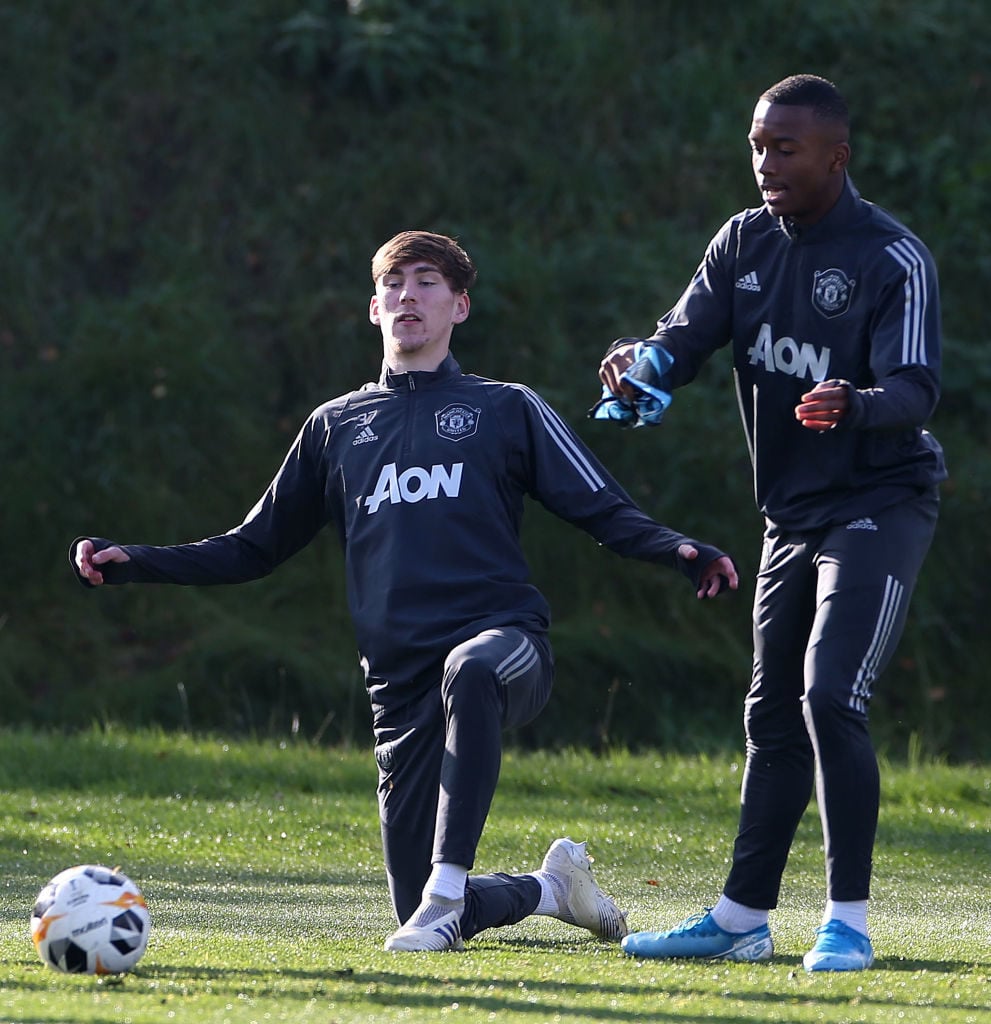 MANCHESTER, ENGLAND - OCTOBER 23: James Garner and Ethan Laird of Manchester United in action during a first team training session at Aon Training Complex on October 23, 2019 in Manchester, England.