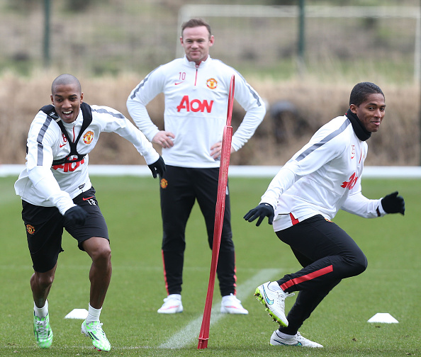 (EXCLUSIVE COVERAGE) Ashley Young, Wayne Rooney and Antonio Valencia of Manchester United in action during a first team training session at Aon Tra...
