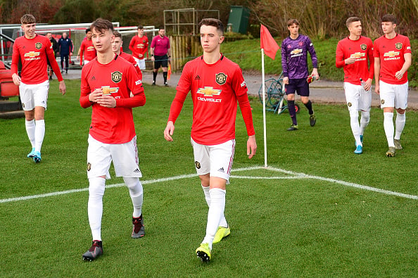 MANCHESTER, ENGLAND - DECEMBER 07: Martin Svidersky and Harvey Neville of Manchester United U18s walk out ahead of the U18 Premier League match between Manchester United U18s and Stoke City U18s at Aon Training Complex on December 07, 2019 in Manchester, England. 
