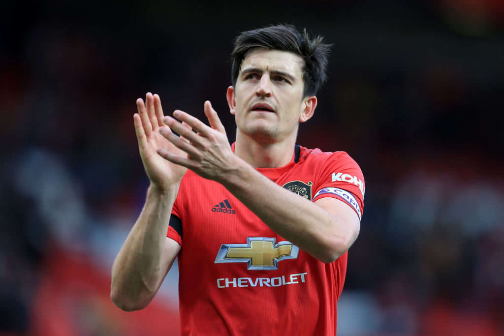 MANCHESTER, ENGLAND - FEBRUARY 23: Harry Maguire of Man Utd applauds the support after the Premier League match between Manchester United and Watford FC at Old Trafford on February 23, 2020 in Manchester, United Kingdom.