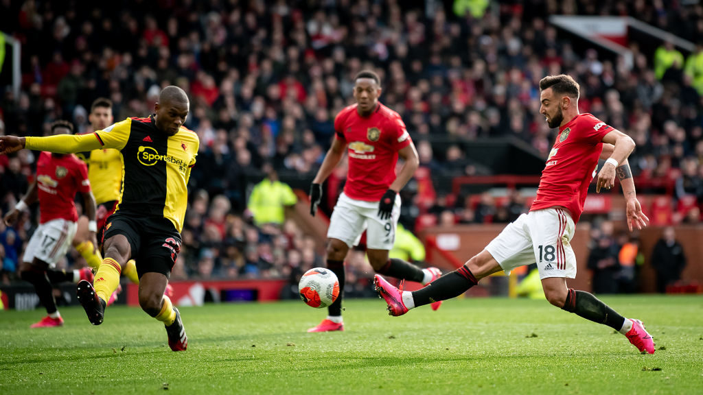 MANCHESTER, ENGLAND - FEBRUARY 23: Bruno Fernandes of Manchester United in action with Christian Kabasele of Watford during the Premier League match between Manchester United and Watford FC at Old Trafford on February 23, 2020 in Manchester, United Kingdom.