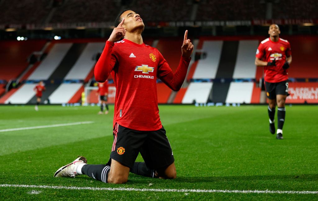 MANCHESTER, ENGLAND - OCTOBER 28: Mason Greenwood of Manchester United celebrates after scoring his sides first goal during the UEFA Champions League Group H stage match between Manchester United and RB Leipzig at Old Trafford on October 28, 2020 in Manchester, England. Sporting stadiums around the UK remain under strict restrictions due to the Coronavirus Pandemic as Government social distancing laws prohibit fans inside venues resulting in games being played behind closed doors. 
