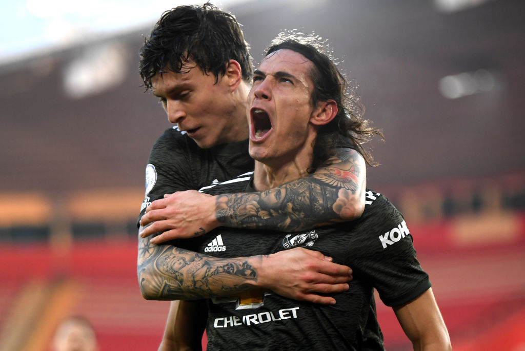 Edinson Cavani (R) of Manchester United celebrates with team mate Victor Lindelof after scoring their sides second goal during the Premier League m...