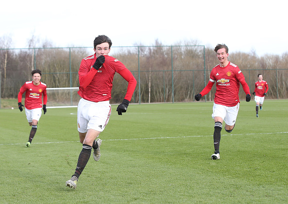 MANCHESTER, ENGLAND - FEBRUARY 13: Charlie McNeill of Manchester United U18s celebrates scoring their first goal during the U18 Premier League match between Manchester United U18s and Manchester City U18s at Aon Training Complex on February 13, 2021 in Manchester, England. 