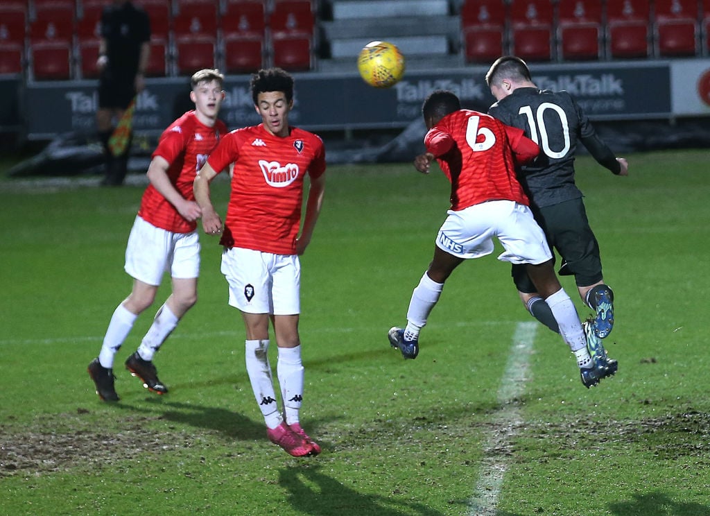 SALFORD, ENGLAND - MARCH 10: Daniel Gore of Manchester United U18s scores their first goal during the FA Youth Cup match between Salford City U18s and Manchester United U18s at Peninsula Stadium on March 10, 2021 in Salford, England. 