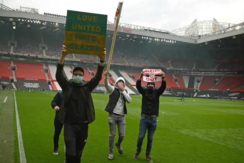 Manchester United fans react as club install metal barriers outside Old Trafford