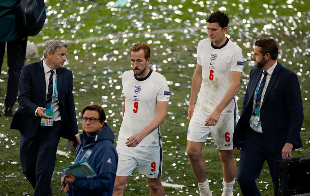 Harry Kane and Harry Maguire of England look dejected following defeat in the UEFA Euro 2020 Championship Final between Italy and England at Wemble...