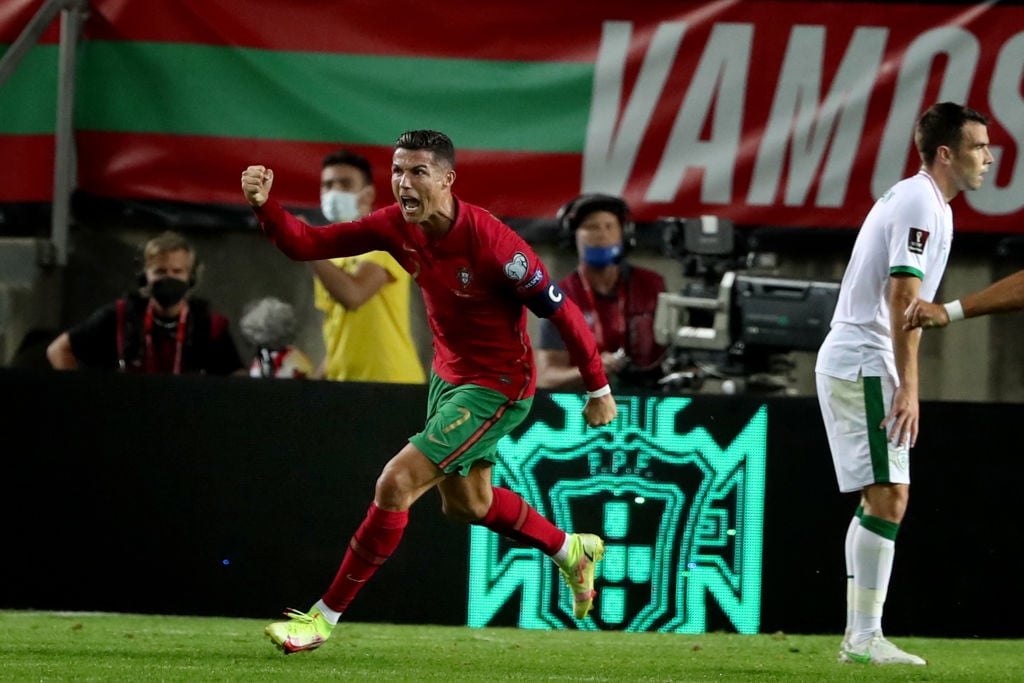 Portugal's forward Cristiano Ronaldo celebrates after scoring a goal and breaks Ali Daeis 109-goal international world record during the FIFA World...