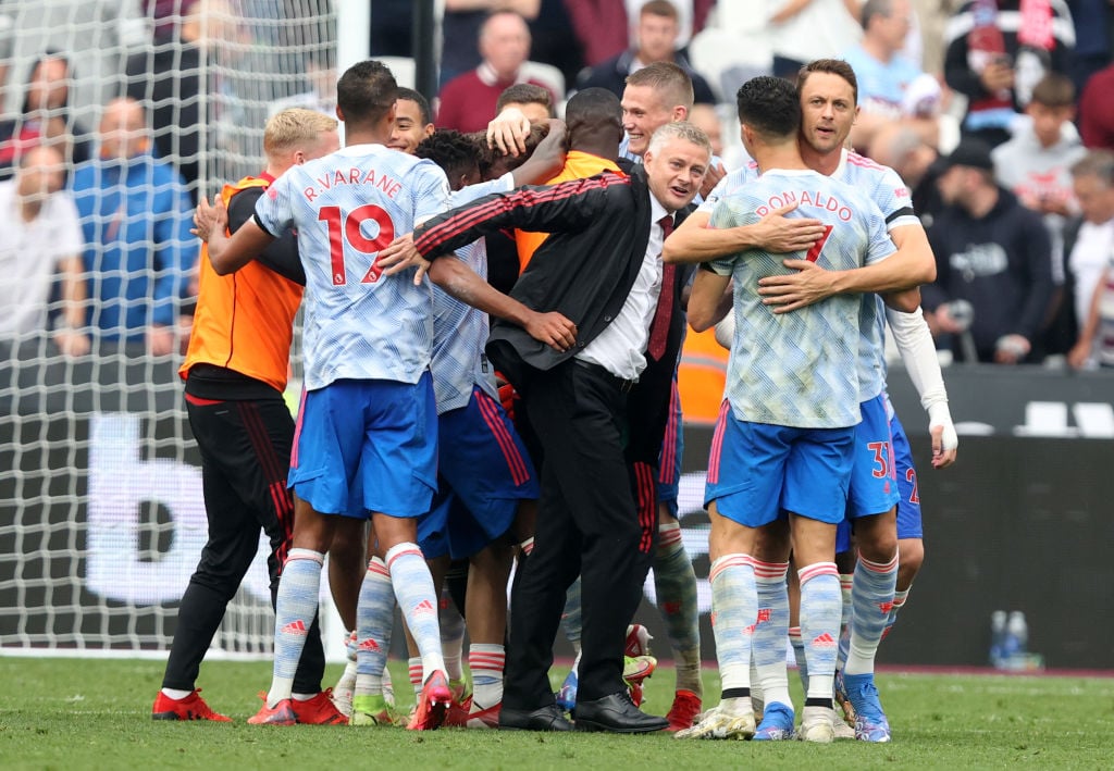 Ole Gunnar Solskjaer, Manager of Manchester United and Players of Manchester United embrace teammate David De Gea after saving the penalty taken by...