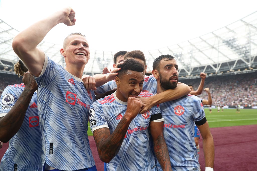 Jesse Lingard of Manchester United celebrates with teammates after scoring their side's second goal during the Premier League match between West Ha...