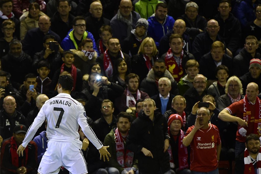 Real Madrid's Portuguese forward Cristiano Ronaldo celebrates in front of the home fans after scoring the opening goal during the UEFA Champions Le...