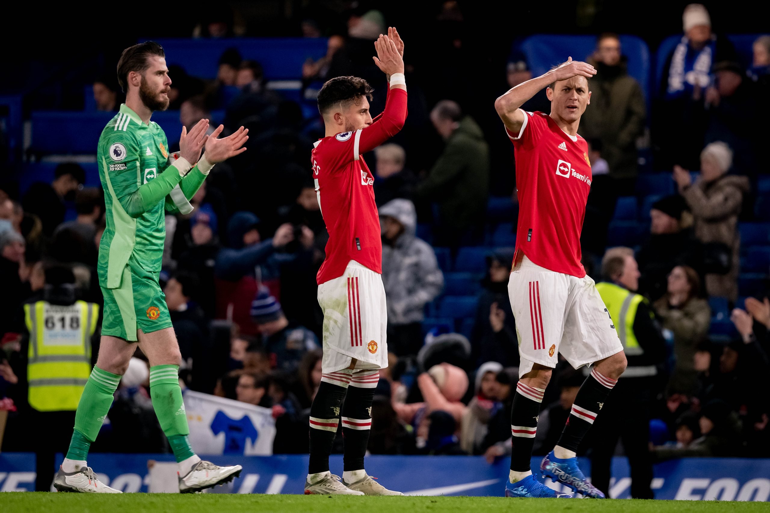 David de Gea and Alex Telles of Manchester United applaud the fans after the Premier League match between Chelsea and Manchester United at Stamford...