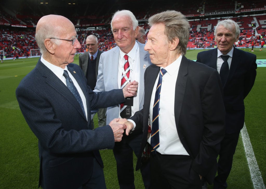 Sir Bobby Charlton and Denis Law meet ahead of the Premier League match between Manchester United and Watford at Old Trafford on May 13, 2018 in Ma...