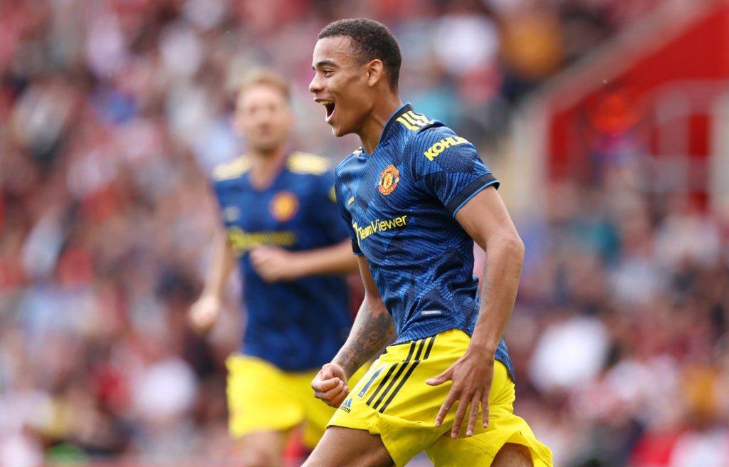 Mason Greenwood of Manchester United celebrates after scoring their side's first goal during the Premier League match between Southampton and Manch...