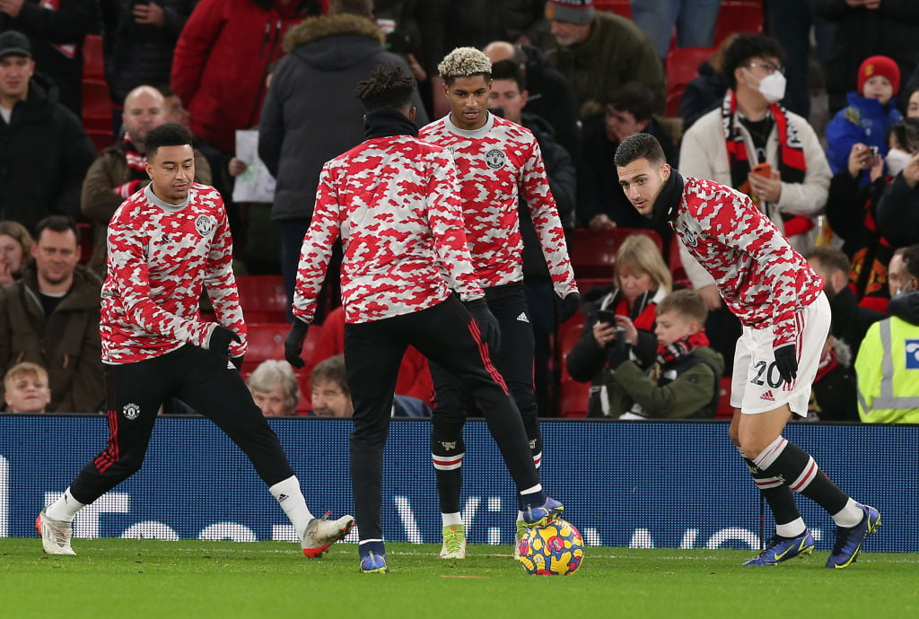 Marcus Rashford and Jesse Lingard work on Pogba-inspired handshake en route  to London (and check out £89m star's 24-carat gold-plated rucksack!)