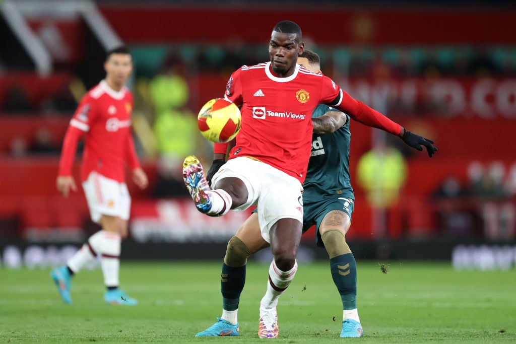 Manchester United's Paul Pogba and Middlesbrough's Marcus Tavernier  during the Emirates FA Cup Fourth Round match between Manchester United and Mi...