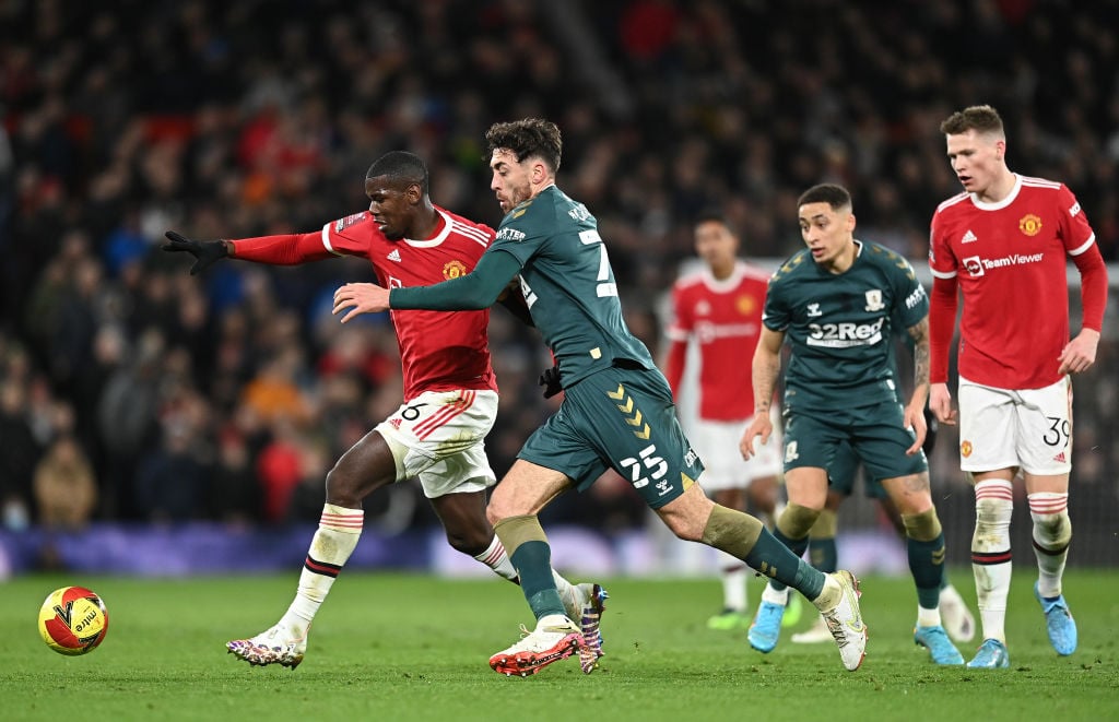 Paul Pogba of Manchester United is challenged by Matt Crooks of Middlesbrough during the Emirates FA Cup Fourth Round match between Manchester Unit...