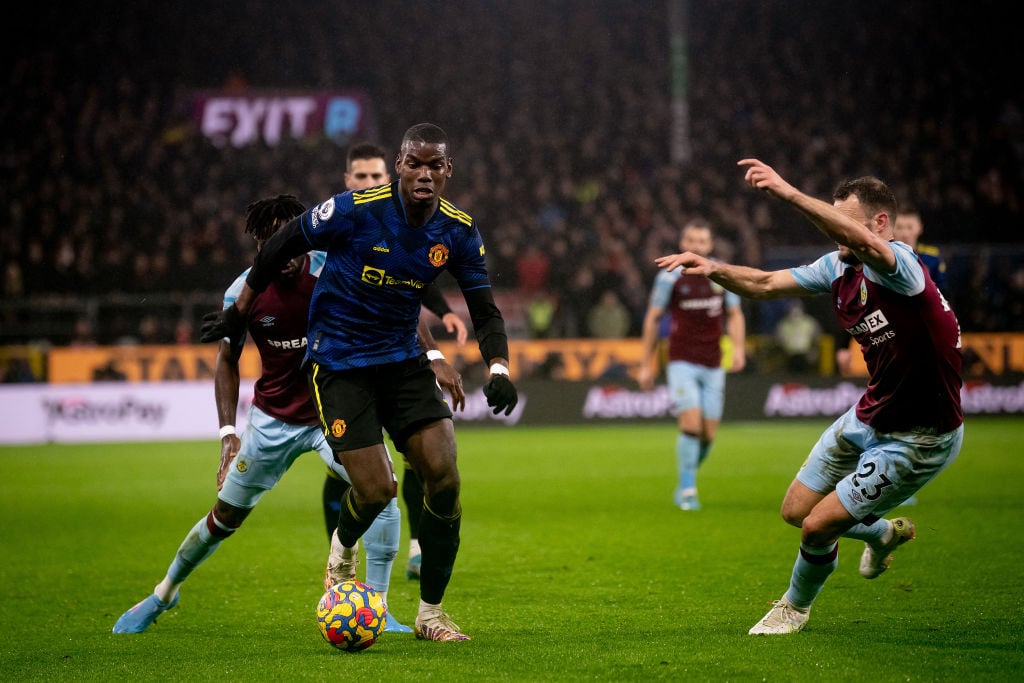 Paul Pogba of Manchester United in action with Erik Pieters of Burnley during the Premier League match between Burnley and Manchester United at Tur...