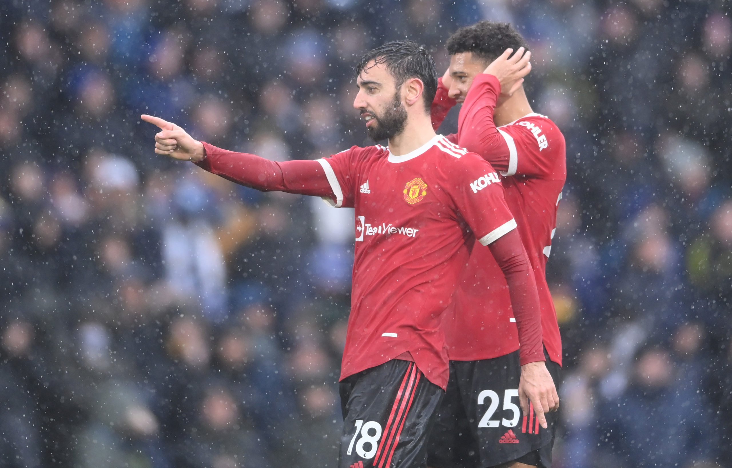 Bruno Fernandes and Jadon Sancho of Manchester United gesture to the Leeds United fans after scoring their sides second goal during the Premier Lea...