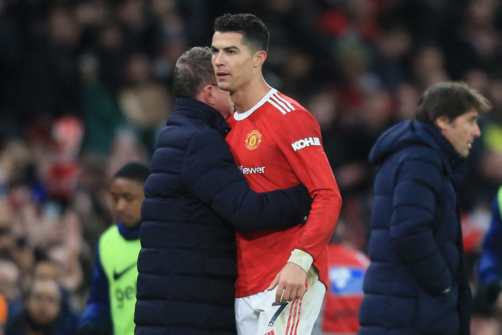 Manchester United German Interim head coach Ralf Rangnick (L) embraces Manchester United's Portuguese striker Cristiano Ronaldo