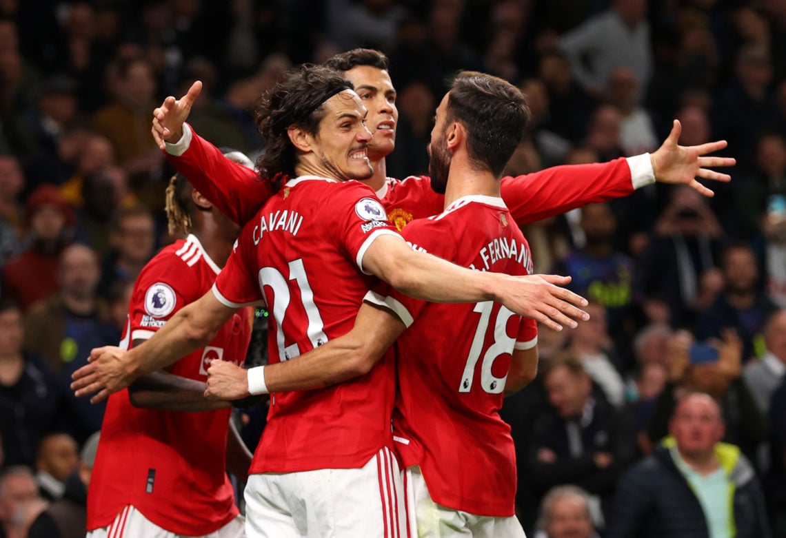 Cristiano Ronaldo of Manchester United celebrates scoring his sides first goal with Edinson Cavani and Bruno Fernandes during the Premier League ma...