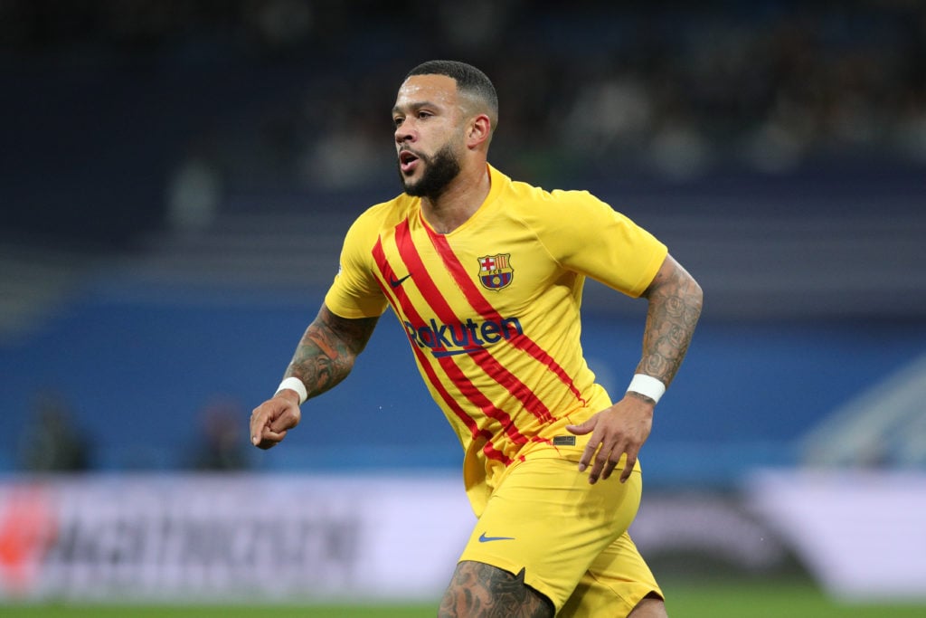 Memphis Depay of FC Barcelona in action during the LaLiga Santander match between Real Madrid CF and FC Barcelona at Estadio Santiago Bernabeu on M...