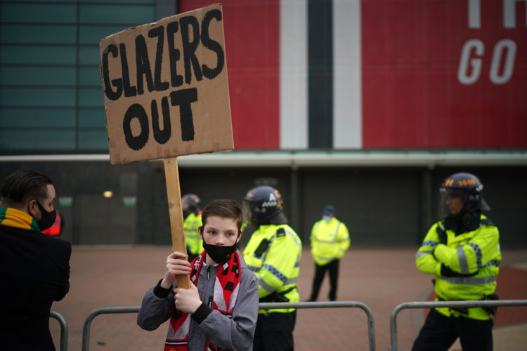 Manchester United fans protest with Glazers Out messages outside Carrington