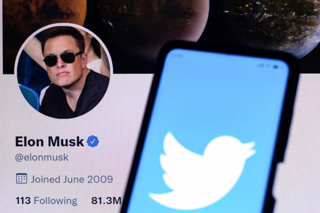 In this photo illustration, the Twitter logo is displayed on