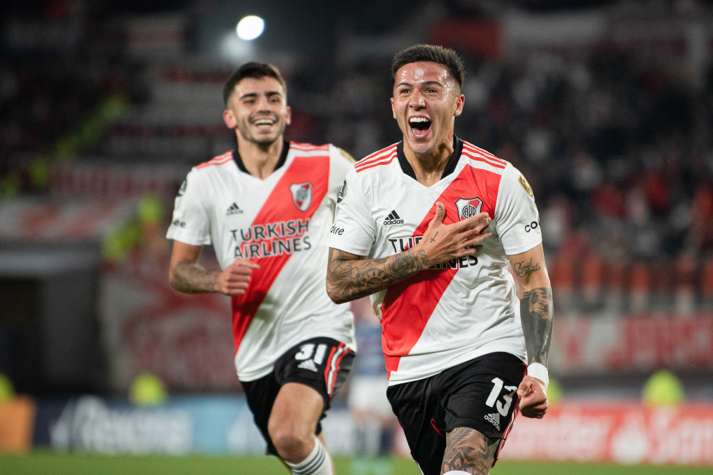 Enzo Fernandez (R) of River Plate celebrates after scoring a...