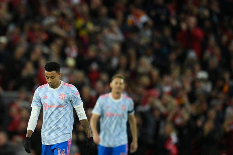 Manchester United's English midfielder Jesse Lingard (L) reacts after Liverpool's Egyptian midfielder Mohamed Salah scored his team second goal dur...