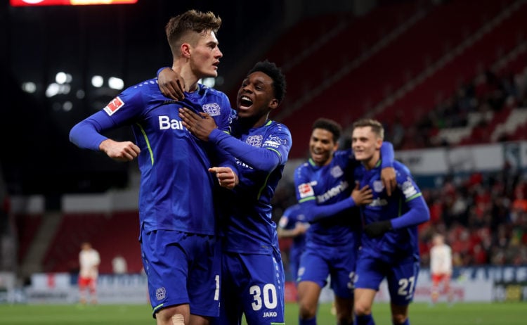 Patrik Schick of Bayer Leverkusen is congratulated by Jeremie Frimpong of blafter scoring the opening goal during the Bundesliga match between 1. F...