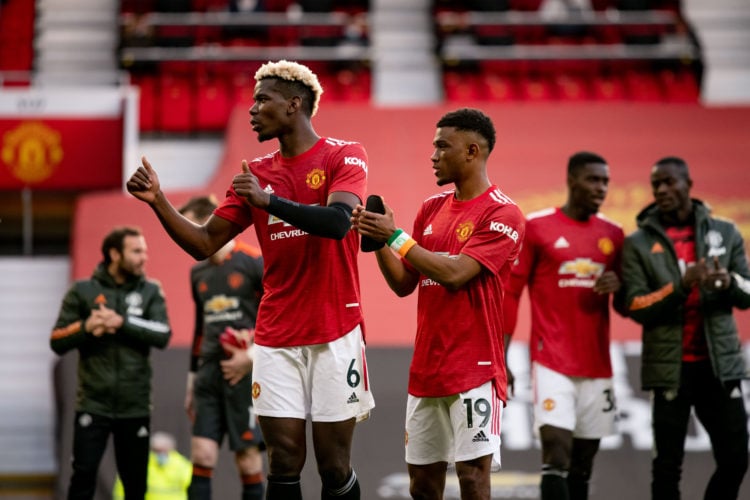 Paul Pogba and Amad of Manchester United applaud the fans at the end of the Premier League match between Manchester United and Fulham at Old Traffo...