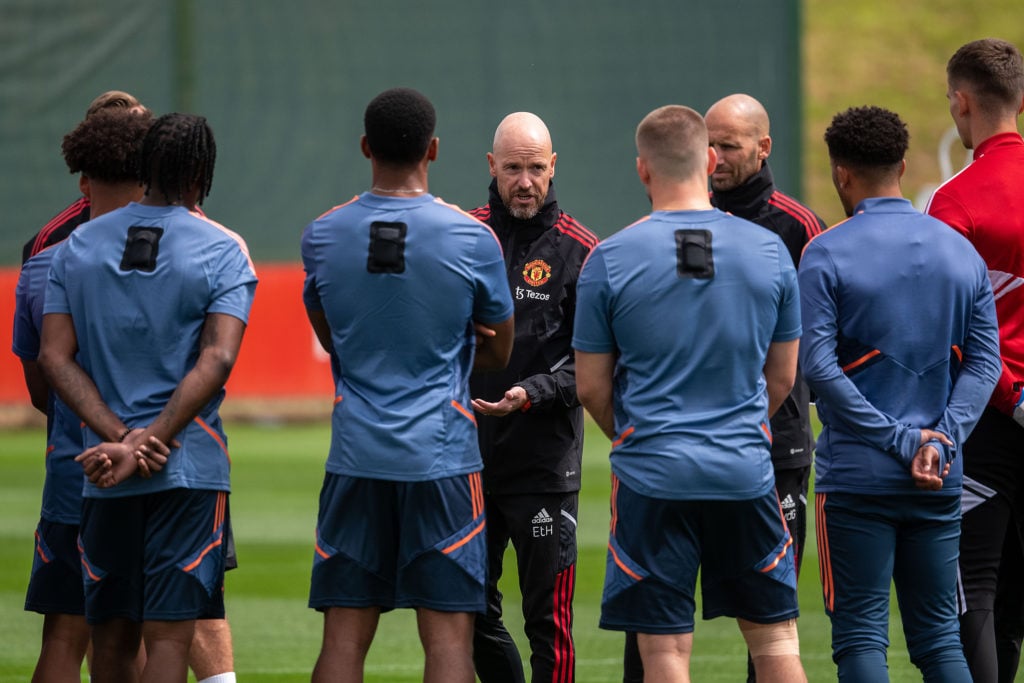 Former Manchester United manager Erik ten Hag talks to players during a first-team training session at the Carrington training complex in 2022 in Manchester.
