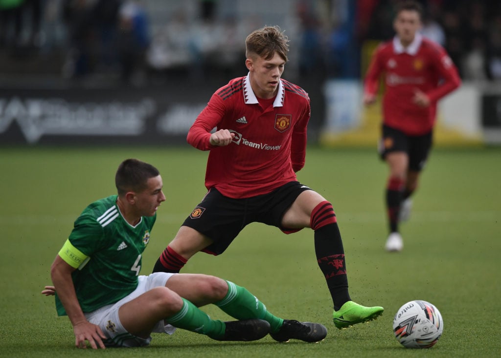 Sam Mather of Manchester United and Daithi McCallion of Northern Ireland during the NI Super Cup match between Northern Ireland and Manchester Unit...