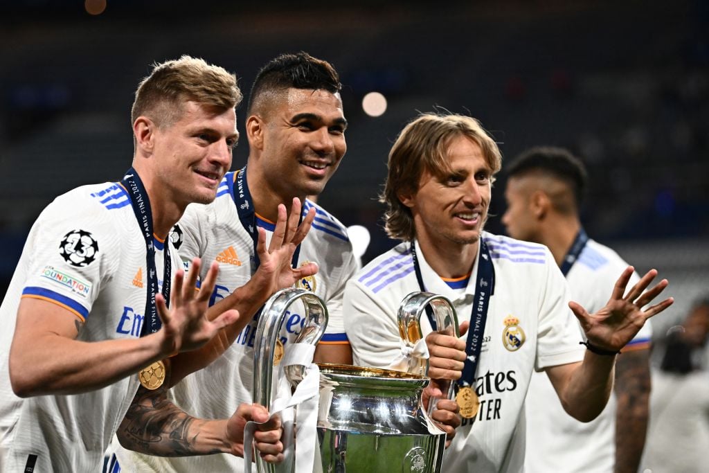 (From L) Real Madrid's German midfielder Toni Kroos, Real Madrid's Brazilian midfielder Casemiro and Real Madrid's Croatian midfielder Luka Modric ...