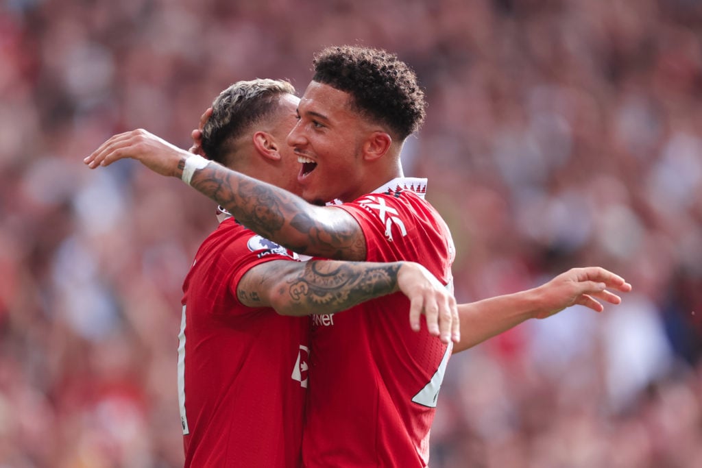 Antony of Manchester United (L) celebrates with Jadon Sancho of Manchester United after scoring their 1st goal during the Premier League match between Manchester United and Arsenal FC at Old Trafford on September 4, 2022