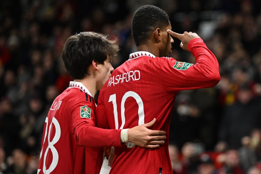 Manchester United's English striker Marcus Rashford (R) celebrates scoring their second goal during the English League Cup quarter final football m...