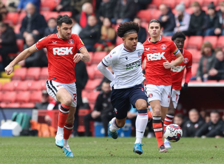 Bolton Wanderers' Shola Shoretire holds off the challenge from Charlton Athletic's Scott Fraser  during the Sky Bet League One between Charlton Ath...