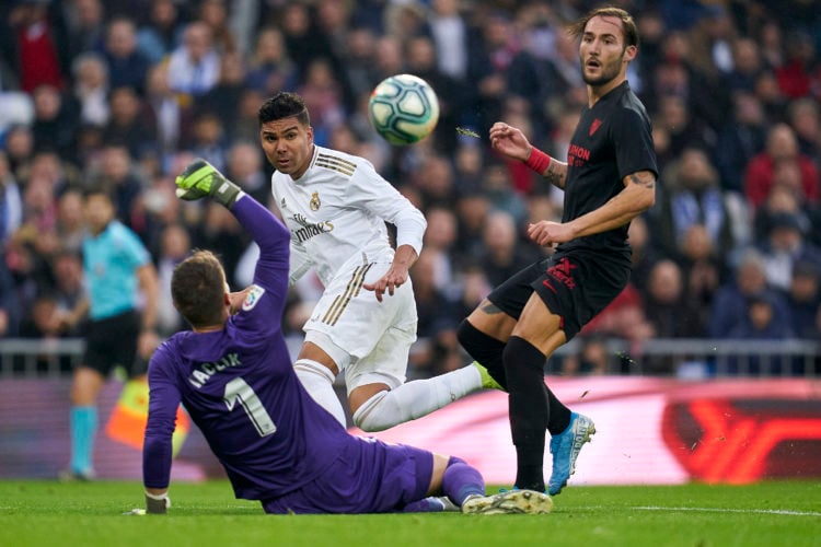 Casemiro of Real Madrid CF scores his team's first goal during the Liga match between Real Madrid CF and Sevilla FC at Estadio Santiago Bernabeu on...