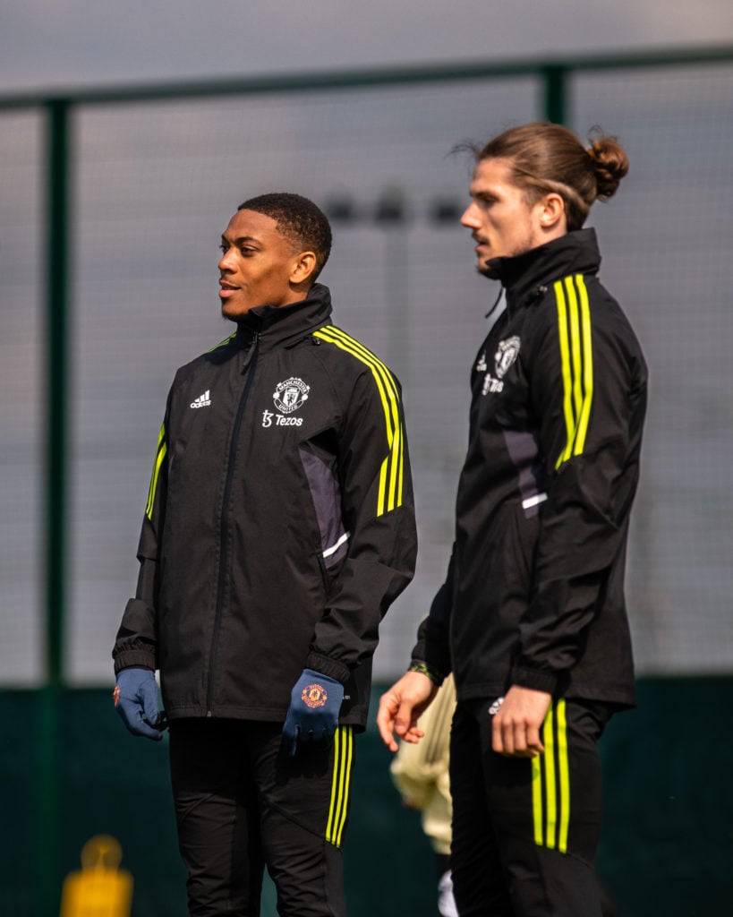 Anthony Martial of Manchester United looks on with Marcel Sabitzer  during a first team training session at Carrington Training Ground ahead of the...