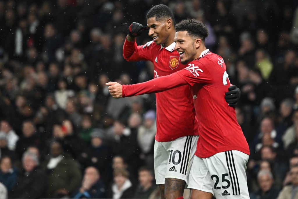 Marcus Rashford of Manchester United celebrates with teammate Jadon Sancho after scoring a goal during the Premier League match between Tottenham Hotspur and Manchester United at Tottenham Hotspur Stadium on April 27, 2023