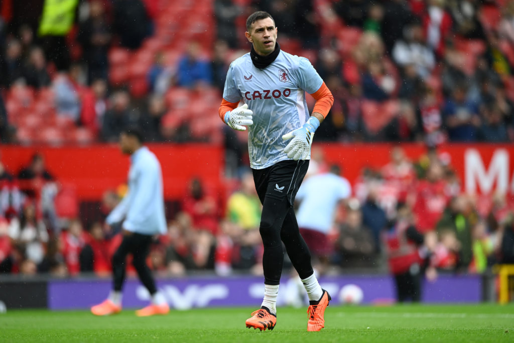 Emiliano Martinez of Aston Villa warms up prior to the Premier League match between Manchester United and Aston Villa at Old Trafford on April 30, 2023