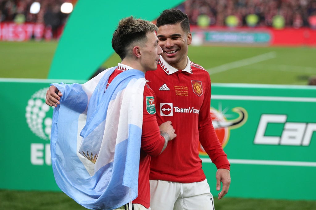 Lisandro Martinez and Casemiro celebrate Carabao Cup triumph.