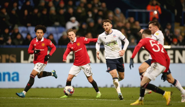 Shola Shoretire and Charlie Savage of Manchester United U21s in action during the Papa John's Trophy match between Bolton Wanderers and Manchester ...