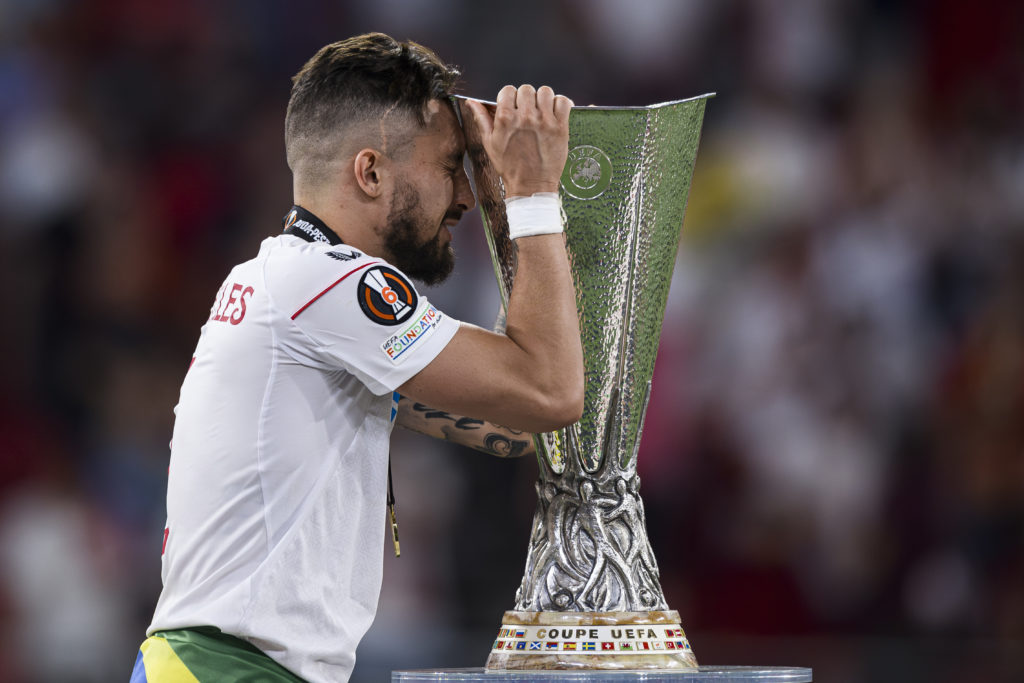 Alex Telles of Sevilla FC celebrates with the trophy during...