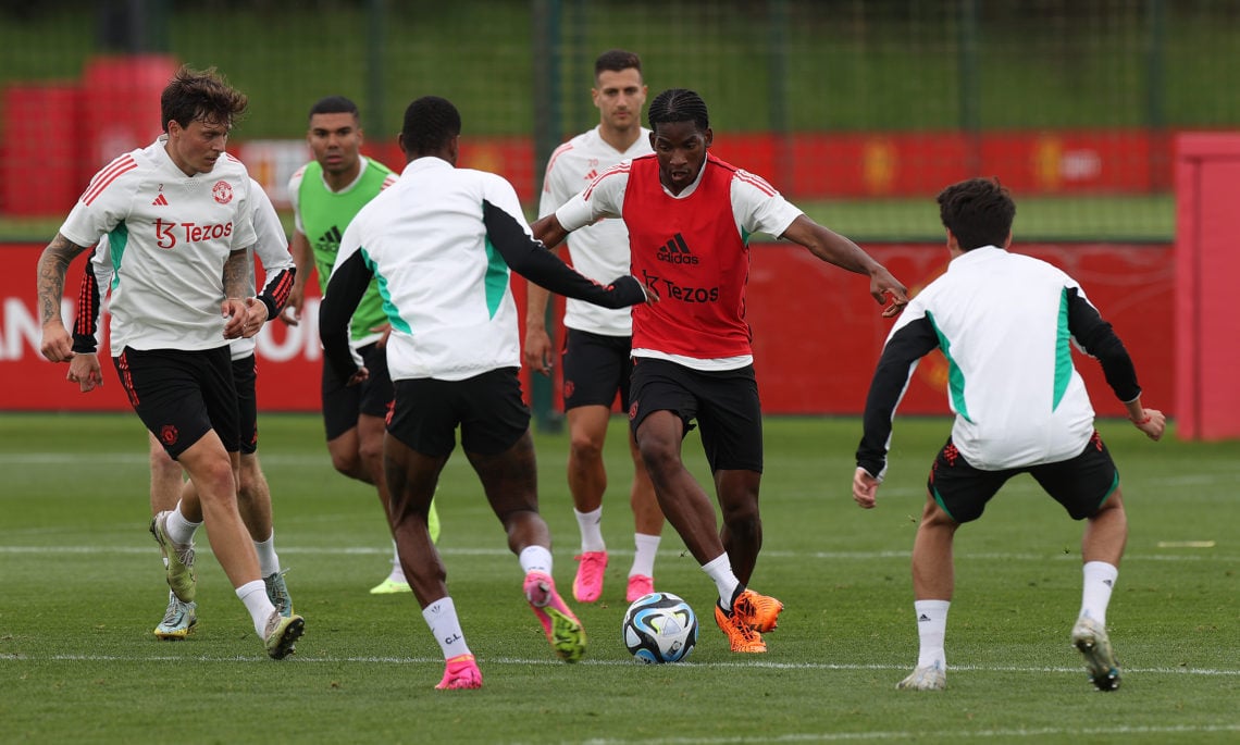Willy Kambwala pictured taking on first team stars as he is called up to Manchester United training