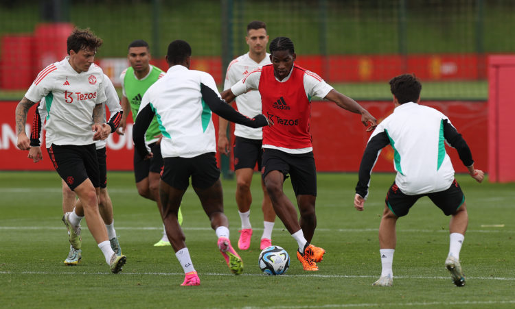 Willy Kambwala pictured taking on first team stars as he is called up to Manchester United training